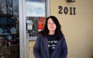 Stacy Downey stands outside The Little Pantry That Could