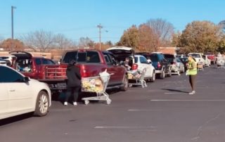 Line of cars at One Generation Away food distribution