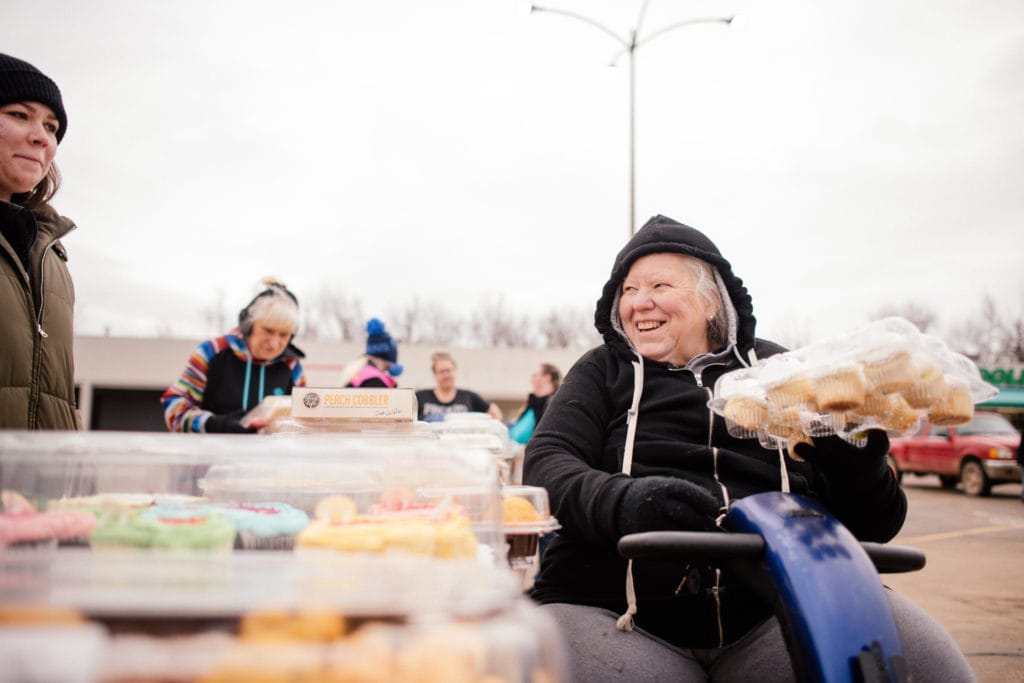 Karen passes out baked goods at One Generation Away's mobile food pantry in Waverly, Tennessee.