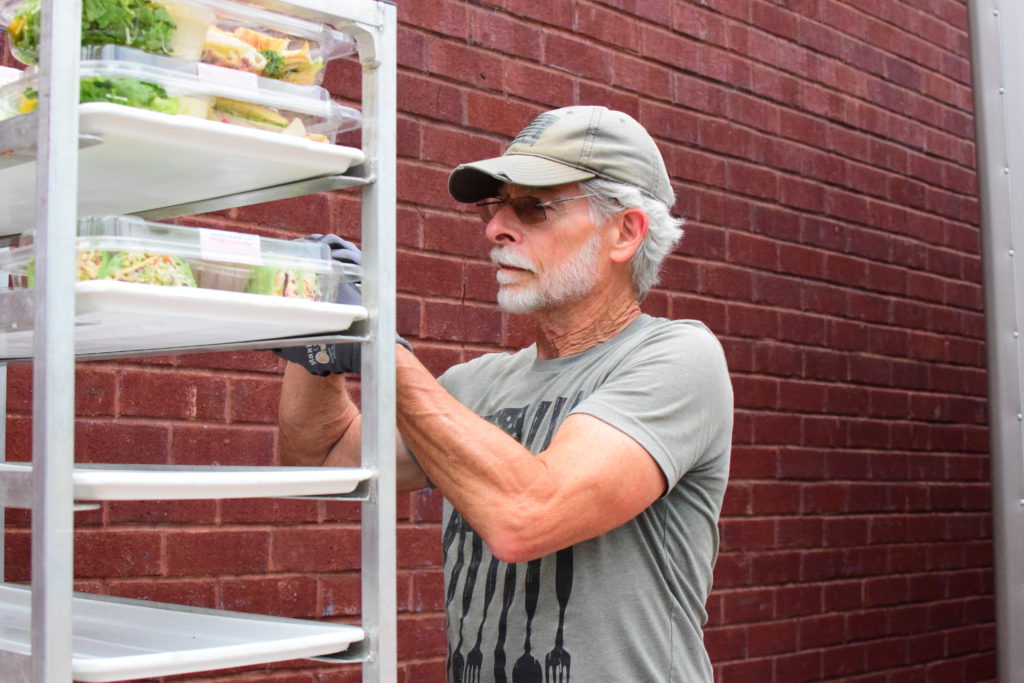 OneGenAway's First Responder Mark rescues food from a grocery store.