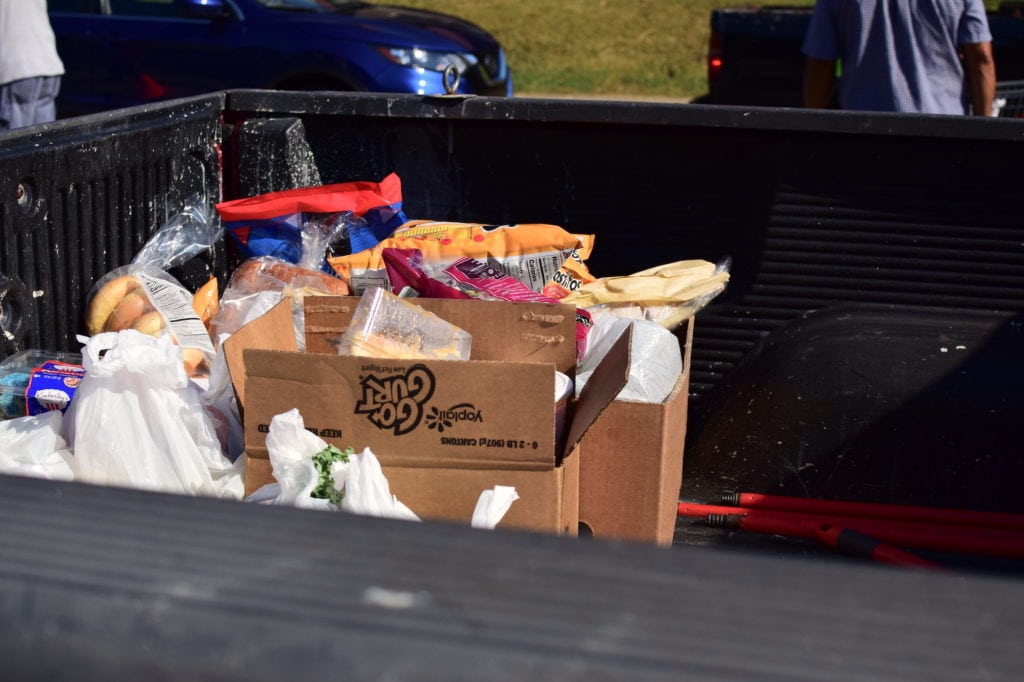 Boxes and bags of groceries sit in the bed of a pickup truck at the OneGenAway Mobile Pantry.